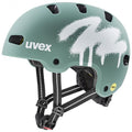 uvex kid 4 style MIPS Fahrradhelm in mattem Salbeigrün mit weißem Spray-Design.