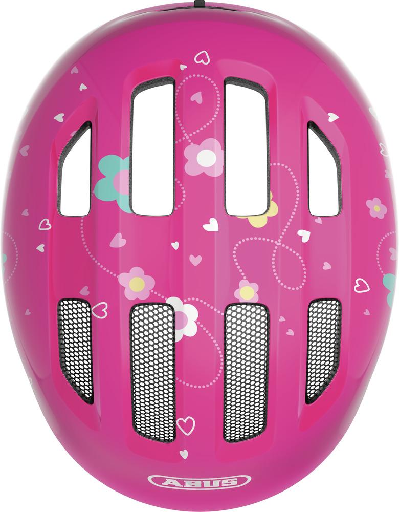 Abus Kinderhelm Smiley 3.0 pink butterfly M 50 bis 55cm mit Blumen- und Herzmuster in der Draufsicht.