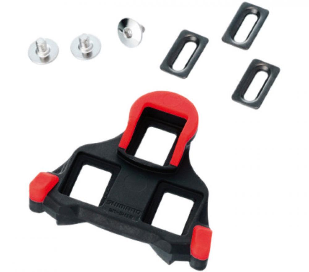 Rote Shimano SM-SH10 SPD-SL Schuhplatten mit Montageschrauben für präzisen Kraftschluss bei Rennradpedalen.