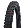 Schwalbe Magic Mary 29x2.40 (62-622) TLE E-50 MTB Downhill Faltreifen mit aggressivem Profil und orangefarbenen Linien.