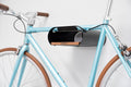 CONTEC bikeART tube Fahrrad-Wandhalterung, Stahl und Walnussholz, Silikonbeschichtung, für Oberrohr-Ø bis 55 mm, Tragfähigkeit bis 25 kg, inkl. Gurt, schwarz/walnuss