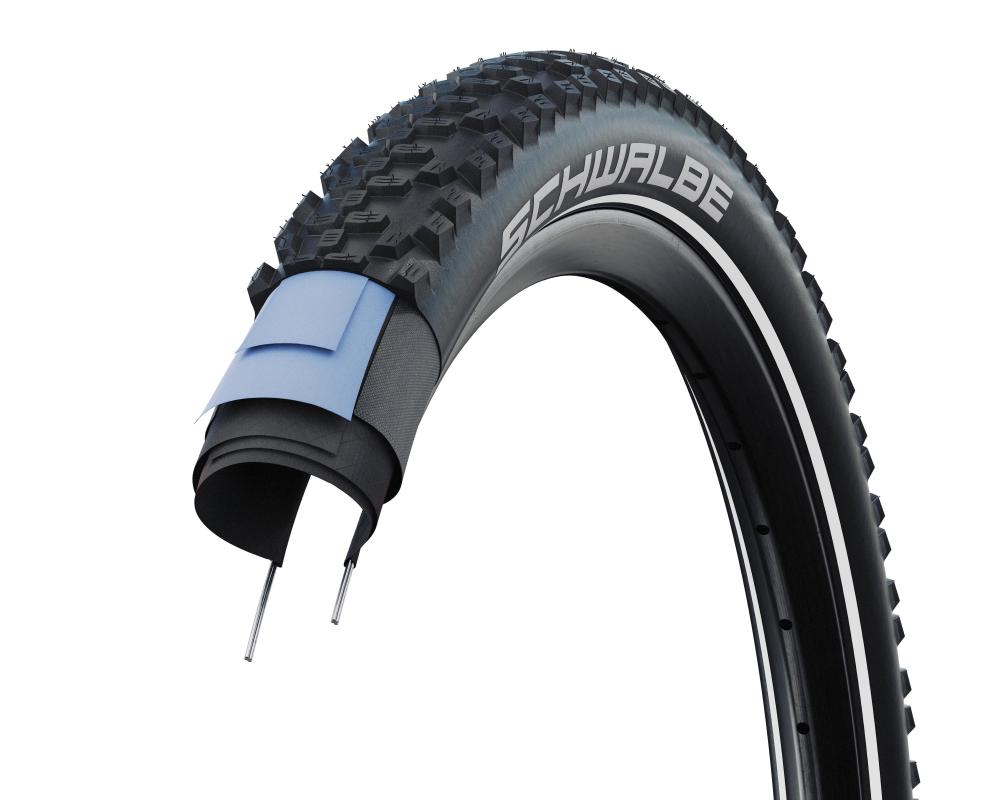 Schwalbe Smart Sam 27,5x2,6 Zoll 65-584 MTB-Allroundreifen Performance Line schwarz mit Querschnitt der Reifenlagen.