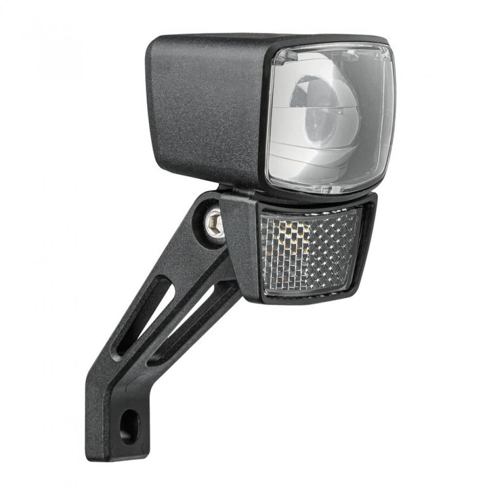 AXA NXT 30 Dynamo-Scheinwerfer 30 Lux Schwarz mit Steady-Light-Funktion auf weißem Grund.