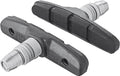 Zwei schwarze SHIMANO M70T4 MTB Bremsschuhe mit silbernen Befestigungsbolzen und Cartridge-Belägen für Alufelgen.