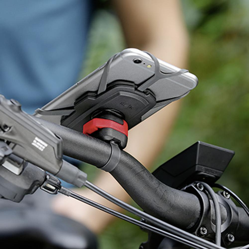 KlickFix PhonePad Quad Mini Smartphonehalterung am Fahrradlenker mit Smartphone befestigt.