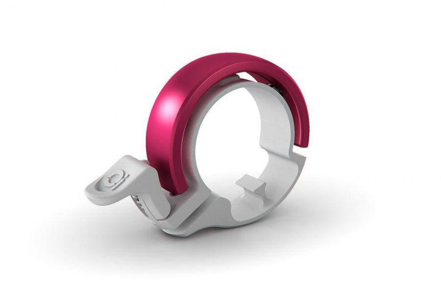 Knog Oi Classic Fahrradklingel groß in Weiß mit pinker Oberseite für Lenker 23.8-31.8mm.