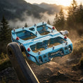 Hellblaue Reverse Escape MTB-Plattformpedale aus Aluminium für maximalen Grip im Bikepark und Downhill.