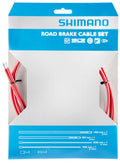 Rotes SHIMANO Road SIL-TEC Bremszug-Set in Originalverpackung mit sichtbaren Kabeln und Hüllen.