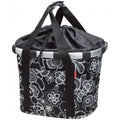 KLICKfix Reisenthel Fahrradkorb Bikebasket fleur schwarz mit weißem Blumenmuster und Zugverschluss.
