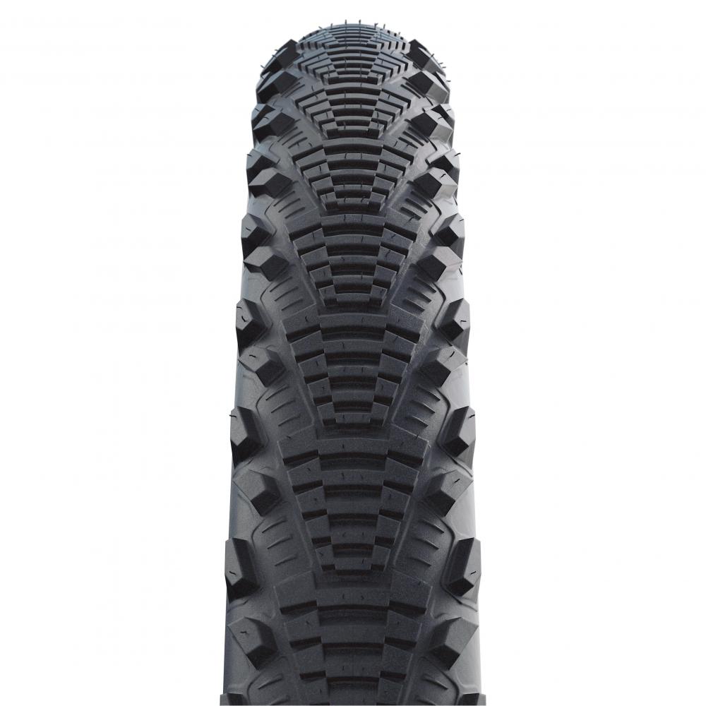 Schwalbe CX Comp 28x1.35 Fahrradreifen mit Semi-Slick Profil für Straße und leichtes Gelände in der Detailansicht.