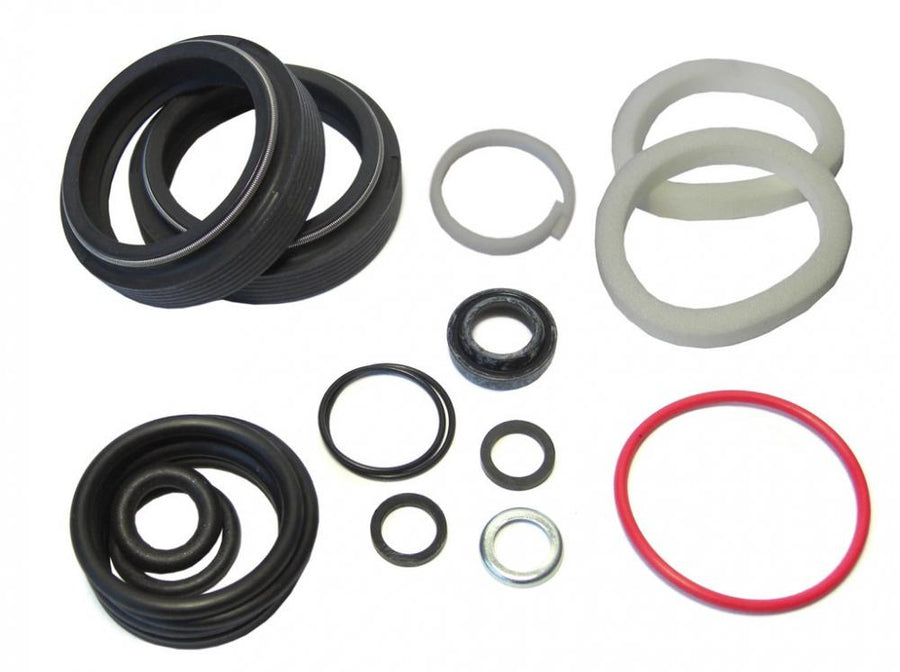 RockShox Pike DJ A1 Federgabel Service-Kit Basic, zeigt verschiedene schwarze Dichtungen, O-Ringe und weiße Schaumringe.