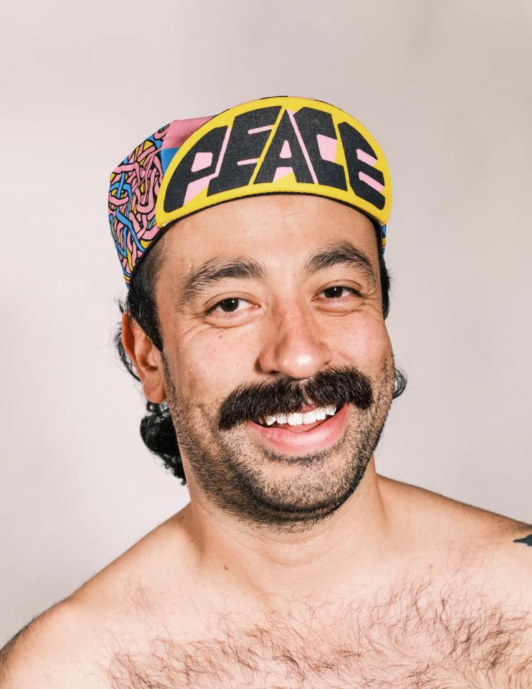 Ass Savers Cap BITS N' PEACES Fahrradkappe auf Mann, gelb "PEACE", buntes Jody Barton Design, Baumwolle, unisex.