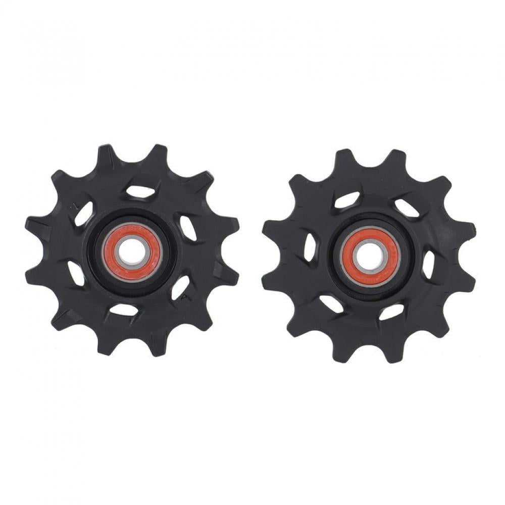 Zwei schwarze SRAM Force XPLR AXS 12-fach Schaltrollen mit roten Lagern für präzises Schalten an Gravel-Antrieben.