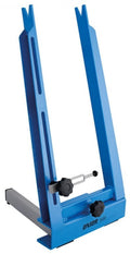 Blauer Unior Zentrierständer 1688 für Fahrradräder auf weißem Hintergrund.
