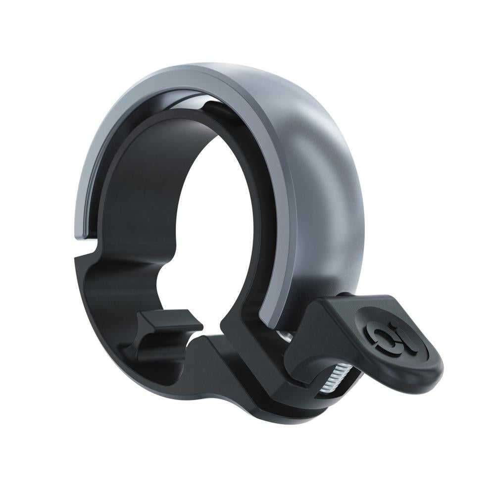 Minimalistische Knog Oi Classic Fahrradklingel groß in schwarz-grau für Lenker 23.8-31.8mm.