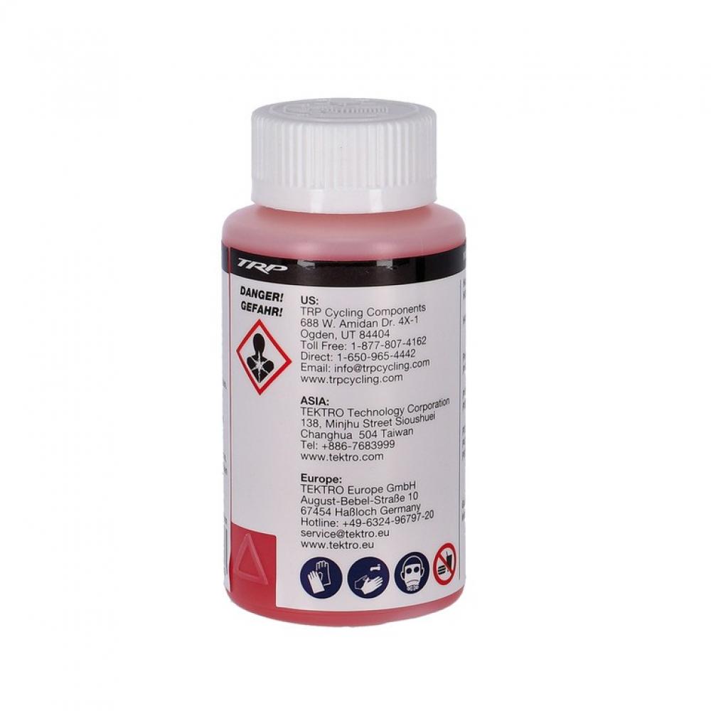 TRP Bremsflüssigkeit Mineralöl 100ml rot. Flasche mit weißem Deckel und Warnhinweisen auf dem Etikett.