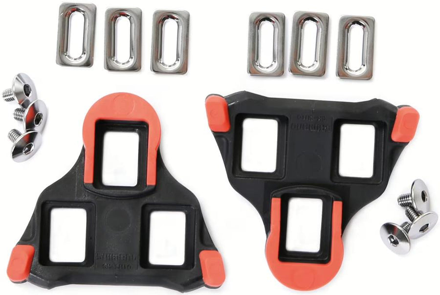 Shimano SM-SH10 SPD-SL Schuhplatten rot mit Montageset für präzisen Kraftschluss an Rennradpedalen.